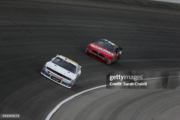 Derek White, driver of the Braille Battery/Grafoid Dodge, practices for the NASCAR Xfinity Series Furious 7 300 at Chicagoland Speedway on September...