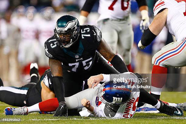 Eli Manning of the New York Giants is taken down by Vinny Curry of the Philadelphia Eagles during the third quarter at Lincoln Financial Field on...