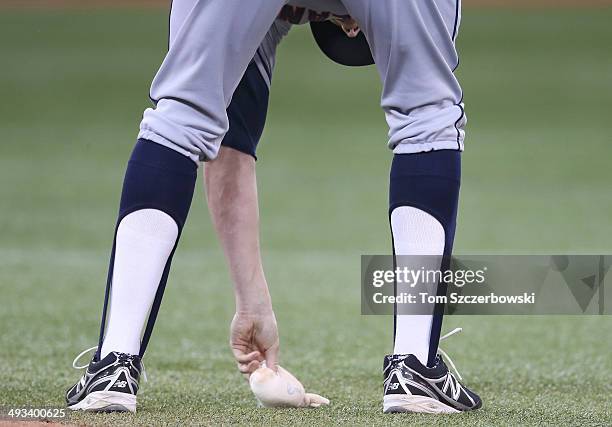 Josh Outman of the Cleveland Indians wears eighties-styles stirrups as he retreives the rosin bag in the sixth inning during MLB game action against...