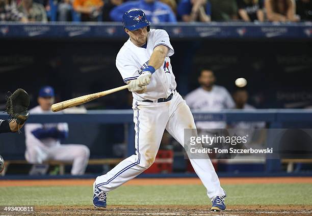 Erik Kratz of the Toronto Blue Jays bats during MLB game action against the Cleveland Indians on May 15, 2014 at Rogers Centre in Toronto, Ontario,...