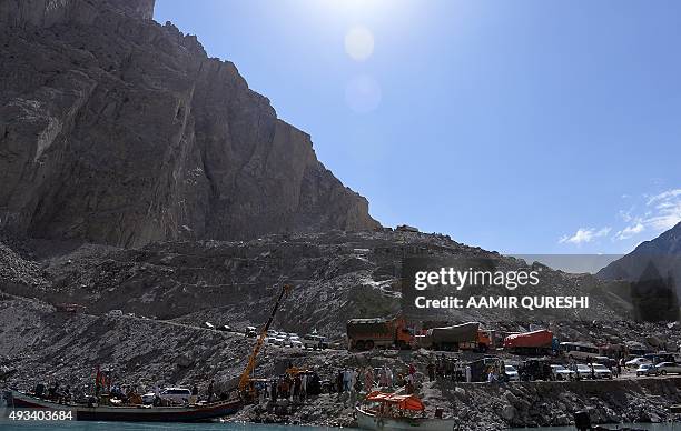 In this photograph taken on on August 3 Pakistani residents board boats used to cross Attabad Lake, which was formed following a landslide in January...