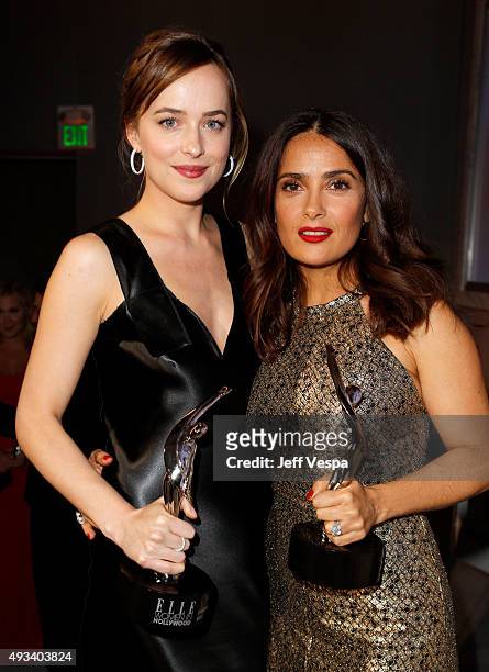 Honorees Dakota Johnson and Salma Hayek attend the 22nd Annual ELLE Women in Hollywood Awards presented by Calvin Klein Collection, L’Oréal Paris,...