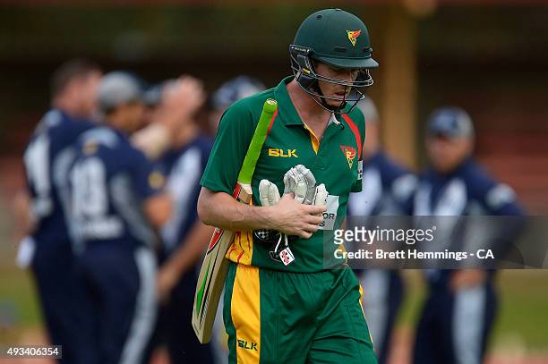 James Faulkner of Tasmania leaves the field after being dismissed by John Hastings of Victoria during the Matador BBQs One Day Cup match between...