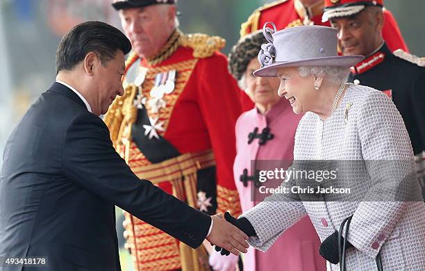 Queen Elizabeth II shakes hands with Chinese President Xi Jinping on Horseguards Parade during the Official Ceremonial Welcome for the Chinese State...