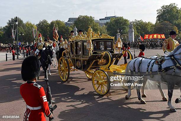 Queen Elizabeth II and the President of China, Xi Jinping, are driven by carriage to Buckingham Palace on October 20, 2015 in London, England. The...