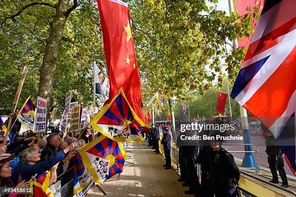 Supporters of Amnesty International wave Tibetan flags during a protest against claims of a deterioration in human rights and censorship of the...