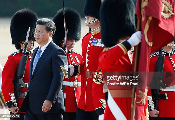 Chinese President Xi Jinping inspects a guard of honour during the official welcome ceremony at Horseguards Parade on October 20, 2015 in London,...