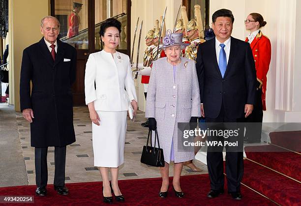 Prince Philip, Duke of Edinburgh, China's First Lady Peng Liyuan, Queen Elizabeth II and China's President Xi Jinping pose for photographers after...