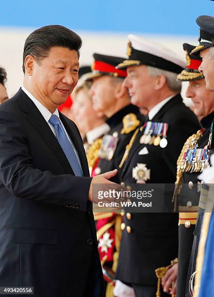 Chinese President Xi Jinping greets British officials and dignitaries during the official welcome ceremony at Horseguards Parade on October 20, 2015...