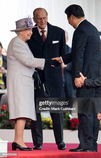 Queen Elizabeth II and Prince Philip, Duke of Edinburgh greet President Xi Jinping at the Official Ceremonial Welcome for the Chinese State Visit on...