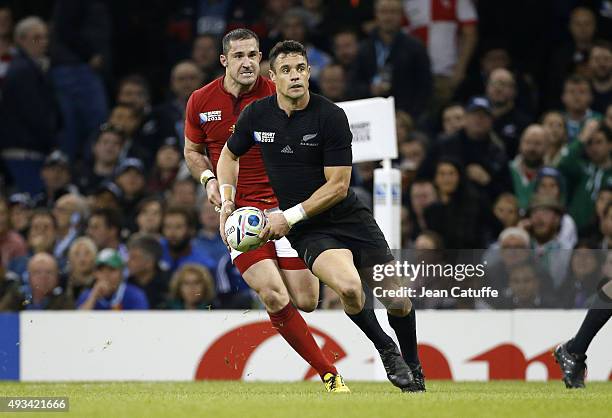 Dan Carter of the New Zealand All Blacks and Scott Spedding of France in action during the 2015 Rugby World Cup Quarter Final match between New...
