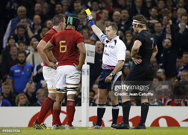 Referee Nigel Owens of Wales delivers a yellow card to Louis Picamoles of France during the 2015 Rugby World Cup Quarter Final match between New...