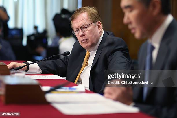 Special Envoy for North Korean Human Rights Issues Robert King listens to Deputy Assistant Secretary of State for Korea And Japan Sung Kim testify...