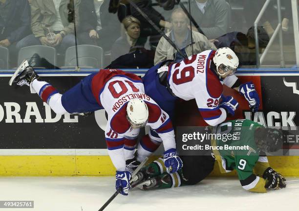 Henrik Samuelsson and Mitchell Moroz of the Edmonton Oil Kings combine to stop Anthony Richard of the Val-d'Or Foreurs during the first period during...