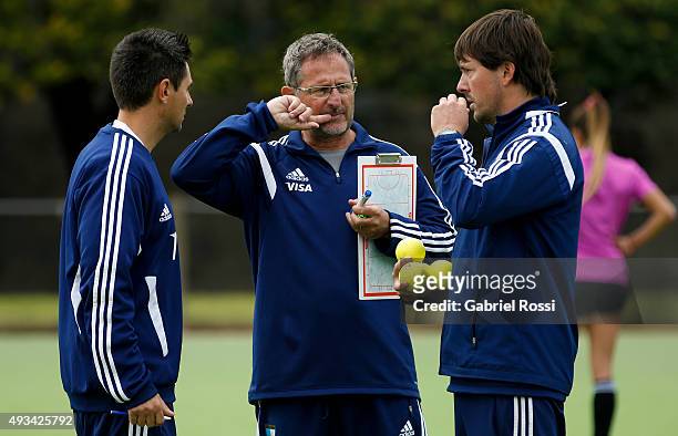 Gabriel Minadeo head coach of Argentina talks with his assistants during Argentina Female Hockey Team training session at CeNARD on October 20, 2015...