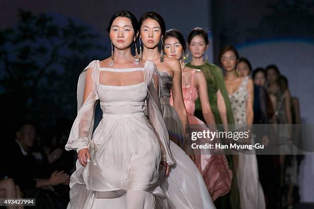 Model Jang Yoon-Ju showcases designs on the runway during the 'Miss Gee Collection' show as part of HERA Seoul Fashion Week S/S 2016 at DDP on...