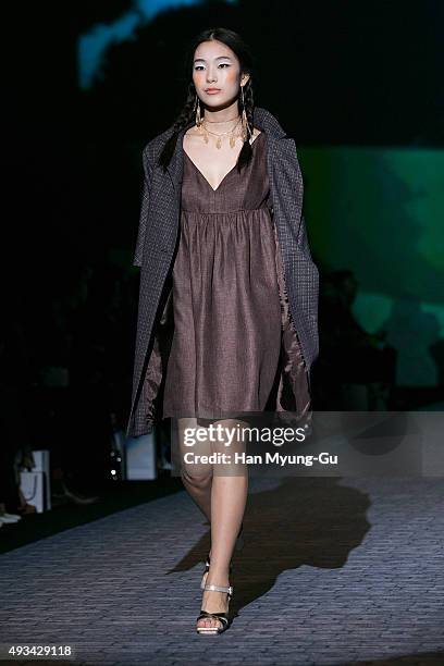 Model showcases designs on the runway during the 'Miss Gee Collection' show as part of HERA Seoul Fashion Week S/S 2016 at DDP on October 20, 2015 in...