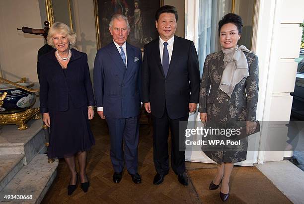 Chinese President Xi Jinping and China's First Lady Peng Liyuan take tea with Camilla, Duchess of Cornwall and Prince Charles, Prince of Wales at...