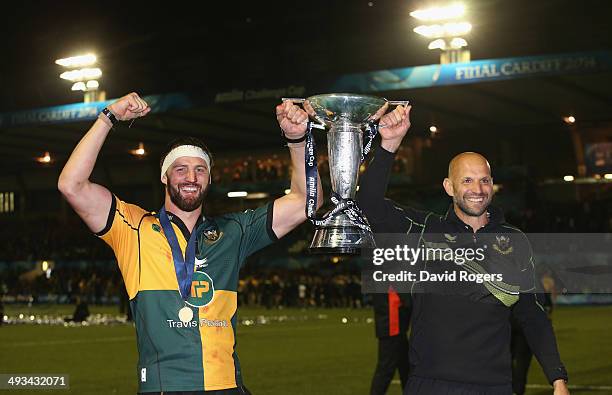 Jim Mallinder, the Northampton Saints directory of rugby celebrates with team captain Tom Wood after their victory during the Amlin Challenge Cup...