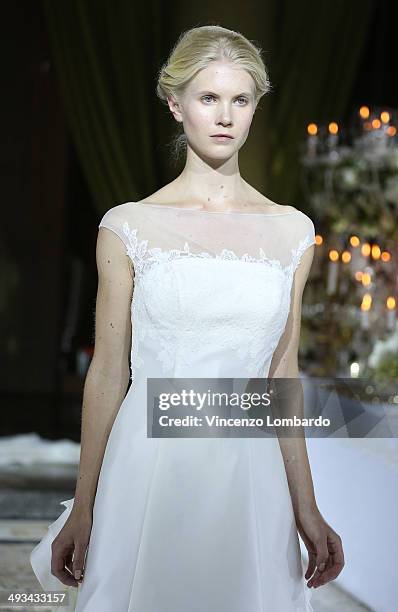 Model walks the runway during the Enzo Miccio Bridal Collection on May 23, 2014 in Milan, Italy.