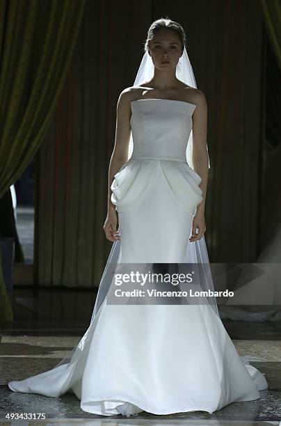 Model walks the runway during the Enzo Miccio Bridal Collection on May 23, 2014 in Milan, Italy.