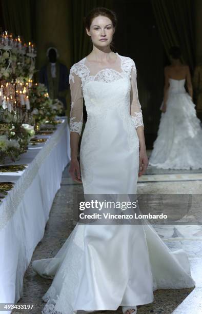 Model walks the runway during the Enzo Miccio Bridal Collection on May 23, 2014 in Milan, Italy.