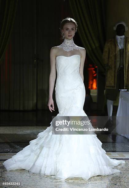 Model walks the runway during the Enzo Miccio Bridal Collection on May 23, 2014 in Milan, Italy.