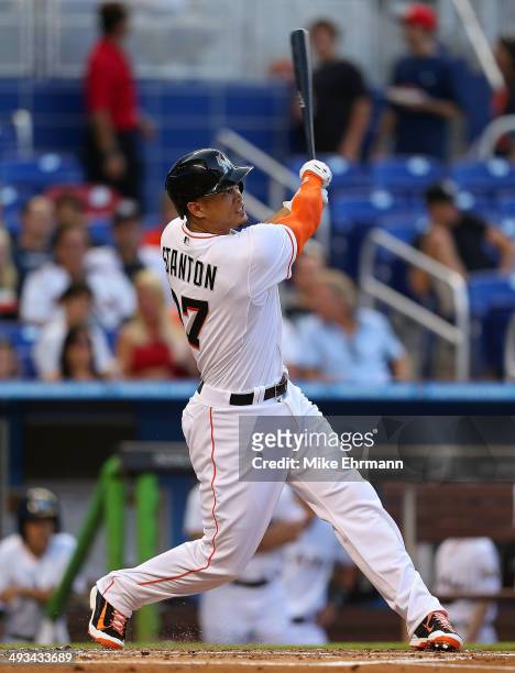Giancarlo Stanton of the Miami Marlins hits a solo home run during a game against the Milwaukee Brewers at Marlins Park on May 23, 2014 in Miami,...
