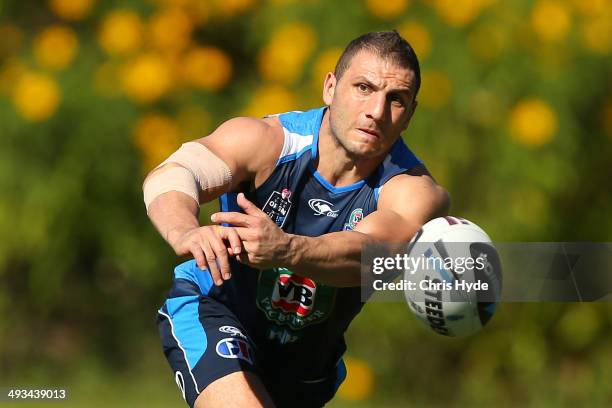 Robbie Farah passes during a New South Wales Blues State of Origin training session on May 24, 2014 in Coffs Harbour, Australia.