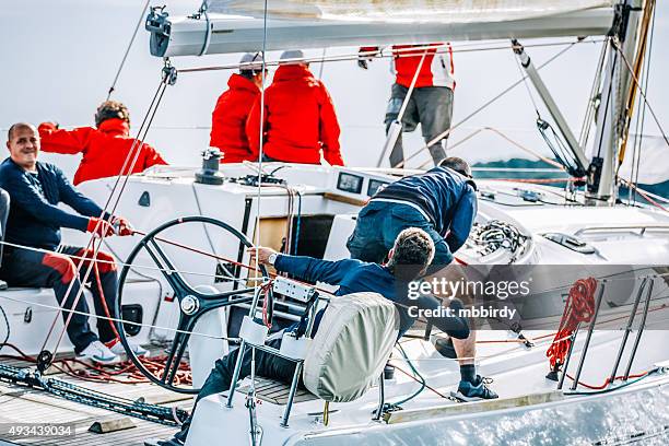 sailing crew on sailboat during regatta - yacht crew stock pictures, royalty-free photos & images