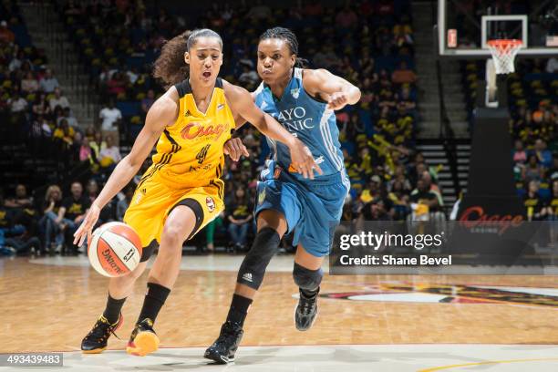 Tan White Minnesota Lynx tries to stop a drive by Skylar Diggins of the Tulsa Shock during the WNBA game on May 23, 2014 at the BOK Center in Tulsa,...