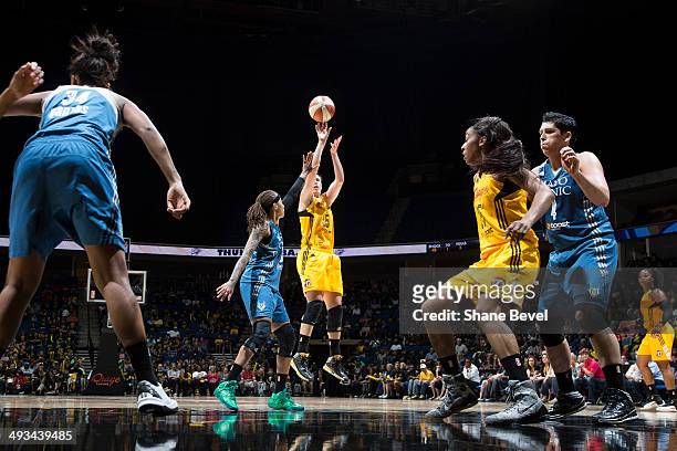 Seimone Augustus of the Minnesota Lynx reaches to block a shot by Jordan Hooper of the Tulsa Shock during the WNBA game on May 23, 2014 at the BOK...
