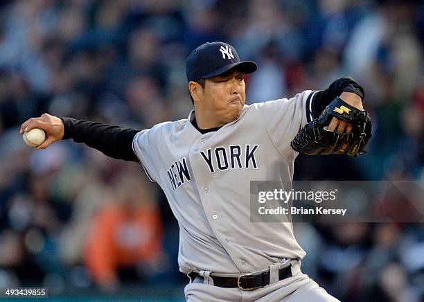 Starting pitcher Hiroki Kuroda of the New York Yankees delivers a pitch during the third inning against the Chicago White Sox at U.S. Cellular Field...