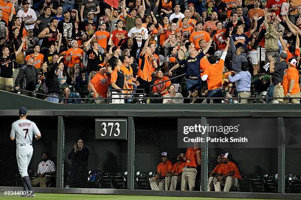 Right fielder David Murphy of the Cleveland Indians watches as a two-run home run hit by Chris Davis of the Baltimore Orioles goes over the outfield...