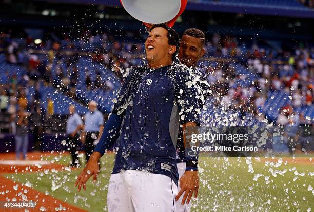 Cole Figueroa of the Tampa Bay Rays is doused with Gatorade by teammate Yunel Escobar after his walk-off RBI double in the ninth inning of a baseball...