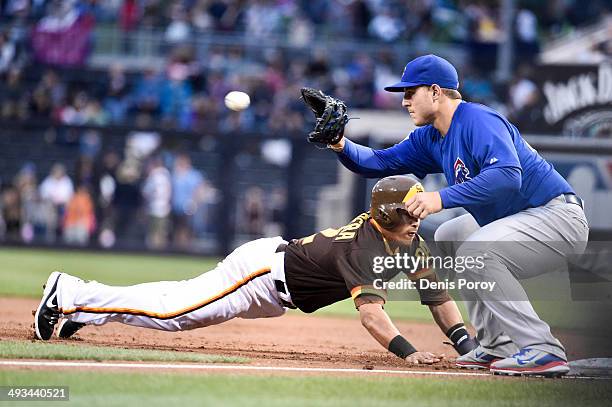 San Diego Padres shortstop Everth Cabrera gets back to first base ahead of the throw to Chicago Cubs first baseman Anthony Rizzo during the first...