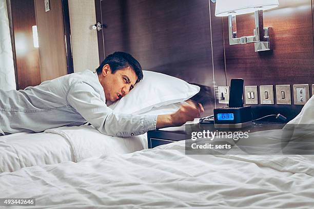 wake up early time - angry sleepless man - bedroom radio stockfoto's en -beelden