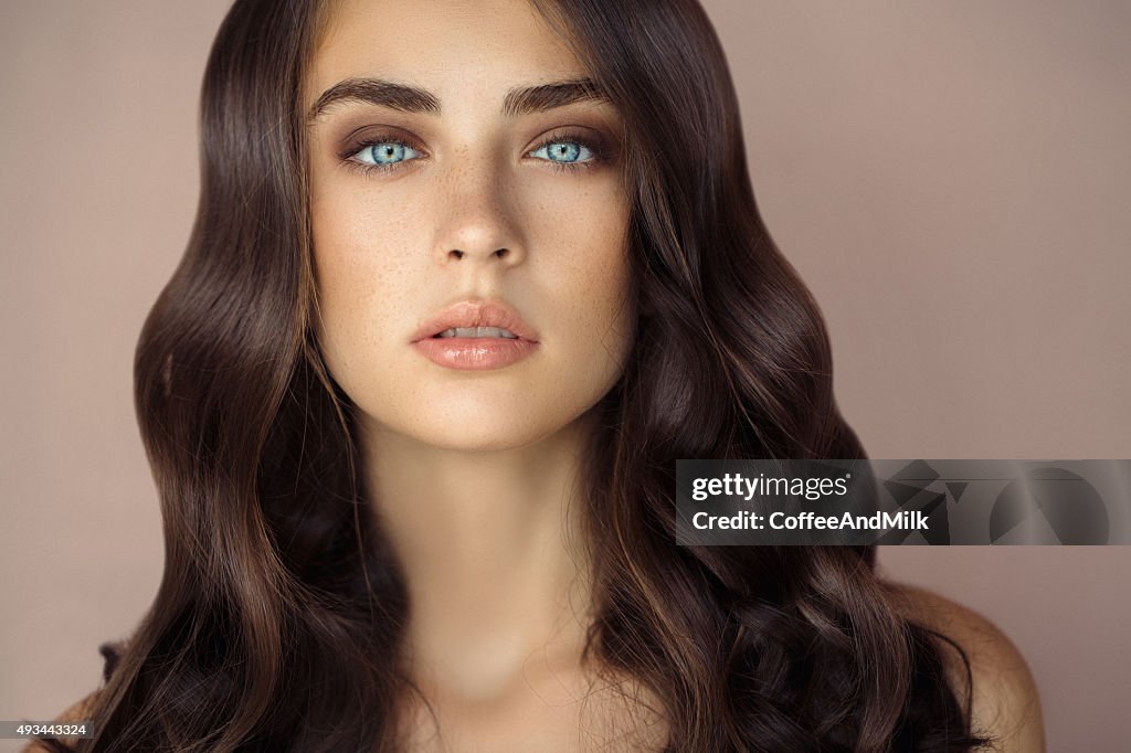 Studio shot of young beautiful woman