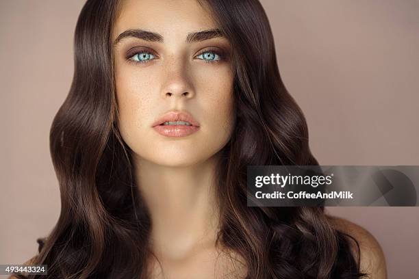 studio shot of young beautiful woman - beauty woman hair stock pictures, royalty-free photos & images