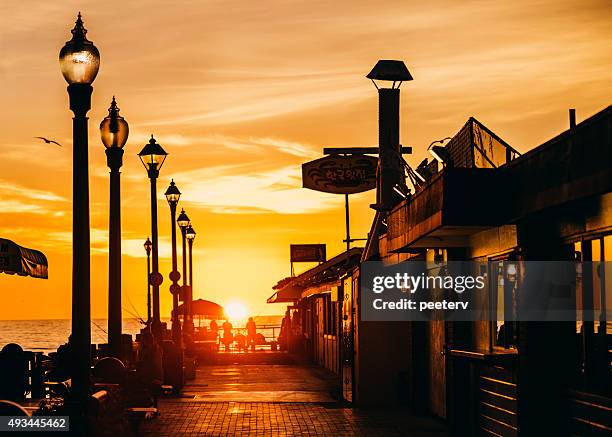 redondo beach pier at sunset. - redondo beach stock pictures, royalty-free photos & images