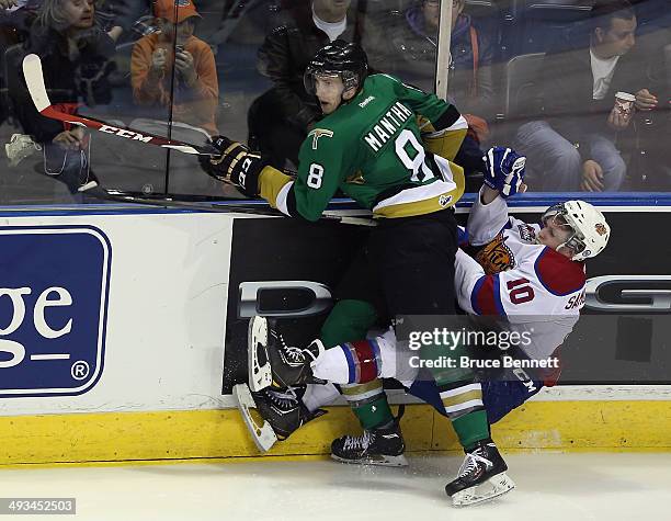 Anthony Mantha of the Val-d'Or Foreurs hits Henrik Samuelsson of the Edmonton Oil Kings into the boards during the second overtime period during the...