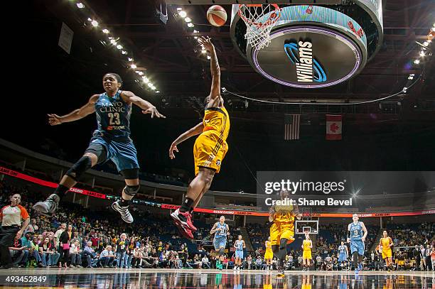 Riquna Williams of the Tulsa Shock shoots against Maya Moore of the Minnesota Lynx on a breakaway during the WNBA game on May 23, 2014 at the BOK...