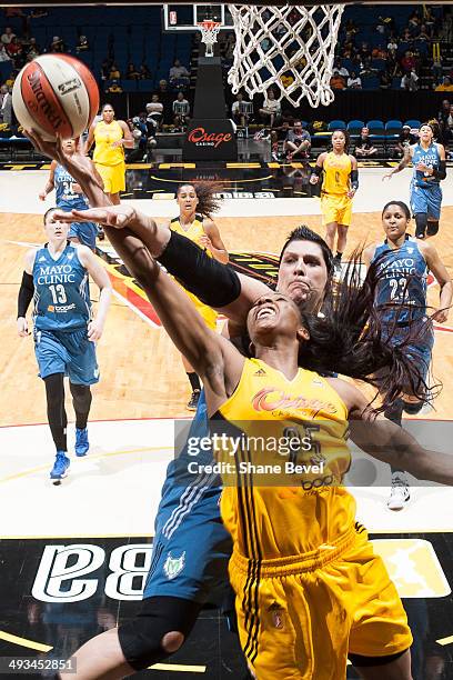 Janel McCarville of the Minnesota Lynx tries to block a shot by Glory Johnson of the Tulsa Shock during the WNBA game on May 23, 2014 at the BOK...