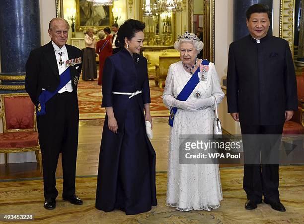 President of China Xi Jinping and his wife Peng Liyuan accompany Britain's Queen Elizabeth II and her husband Prince Philip, Duke of Edinburgh as...