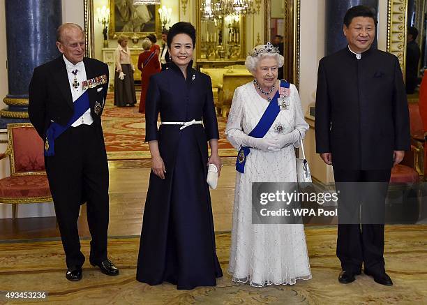 President of China Xi Jinping and his wife Peng Liyuan accompany Britain's Queen Elizabeth II and her husband Prince Philip, Duke of Edinburgh as...