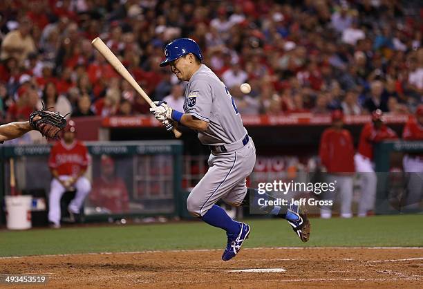 Norichika Aoki of the Kansas City Royals is hit by a pitch in the seventh against the Los Angeles Angels of Anaheim at Angel Stadium of Anaheim on...