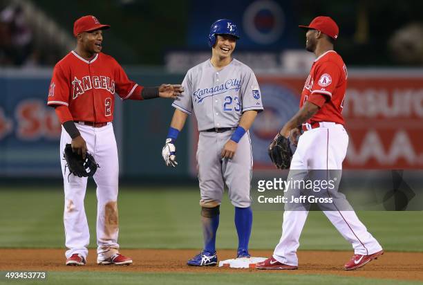 Erick Aybar of the Los Angeles Angels of Anaheim, Norichika Aoki of the Kansas City Royals and Howie Kendrick of the Angels share a laugh during a...