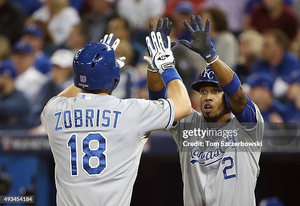 Ben Zobrist of the Kansas City Royals celebrates with Alcides Escobar of the Kansas City Royals after hitting a two-run home run in the first inning...