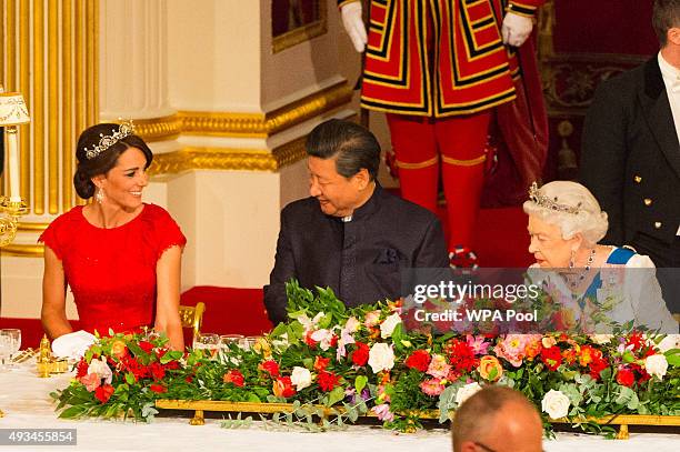 Catherine, Duchess of Cambridge, President of China Xi Jinping and Britain's Queen Elizabeth II attend a state banquet at Buckingham Palace on...