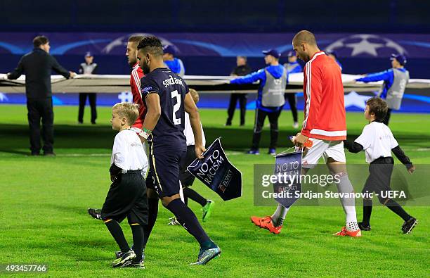 Player of Dinamo Zagreb El Arabi Hilal Soudani and Pajtim Kasami of Olympiacos wear a 'No to Racism' pennant prior to the UEFA Champions League Group...